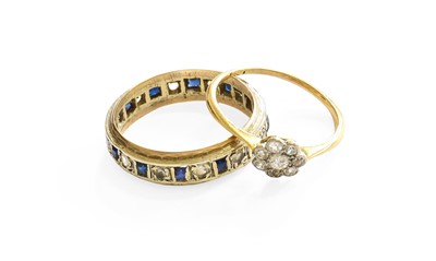 Lot 55 - A Diamond Cluster Ring, the old cut diamonds...