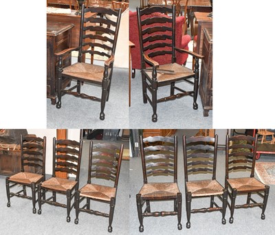 Lot 1175 - A Set of Eight Rush Seated Oak Ladderback Chairs