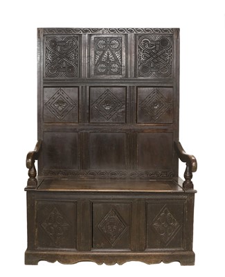 Lot 721 - A Carved Oak Settle, the associated back...