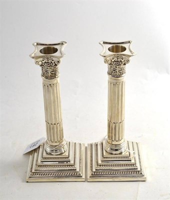 Lot 281 - Pair of loaded silver Corinthian candlesticks