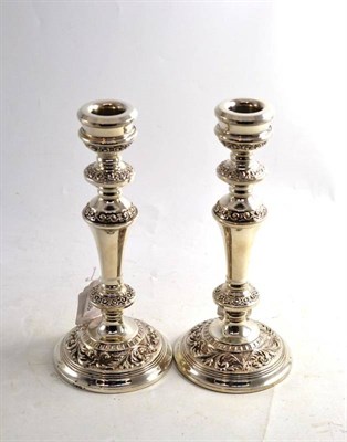 Lot 285 - Pair of loaded silver candlesticks