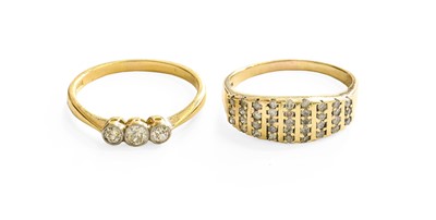 Lot 83 - A 9 Carat Gold Diamond Dress Ring, comprising...