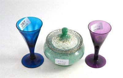 Lot 287 - Two early 19th century coloured wine glasses and a Monart powder bowl and cover