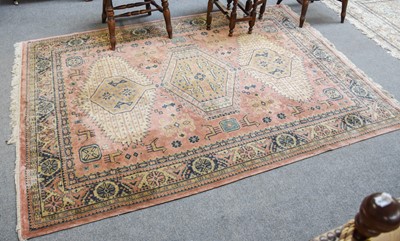 Lot 1018 - A Machine Made Carpet, the field with three...