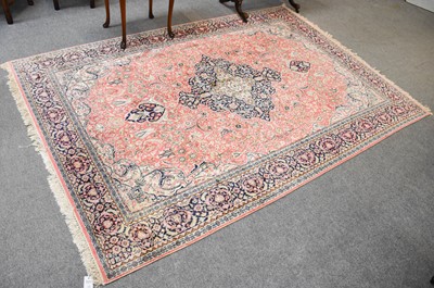 Lot 1014 - A Kashmir Silk Piled Carpet, the coral pink...