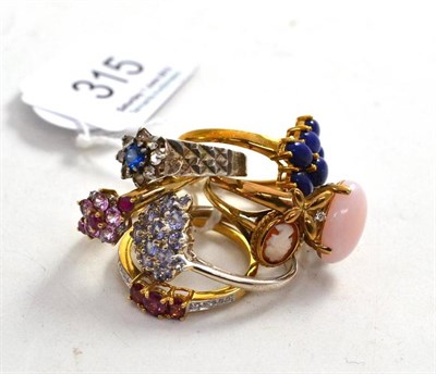 Lot 315 - A lapis lazuli cluster ring, cameo ring, pink coral ring and four semi-precious stone set rings (7)