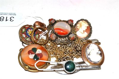 Lot 318 - A 9ct gold buckle ring, an agate brooch, two cameos, a tie slide, chains