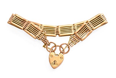 Lot 301 - A Gate Link Bracelet, with a heart-shaped...