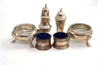 Lot 327 - A pair of George II silver cauldron salts, London 1738, two silver pepperettes, a salt and mustard