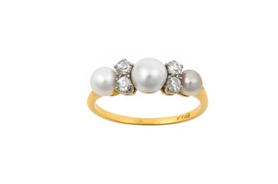 Lot 2142 - A Diamond and Pearl Ring the graduated pearls...