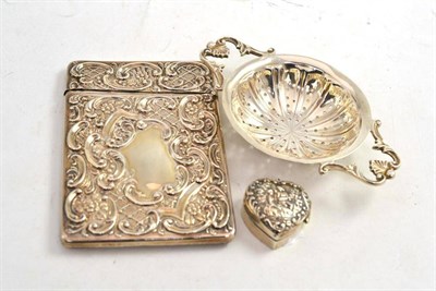 Lot 328 - A silver calling card case, a silver tea strainer and a small silver heart shape pill box (3)