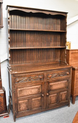 Lot 1348 - A 20th Century Carved Oak Dresser and Rack,...