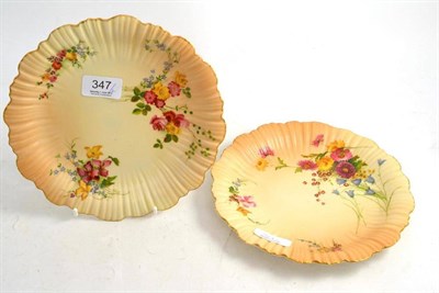 Lot 347 - Two Royal Worcester dessert plates, each on blush ivory ground, with fluted rims, printed and...