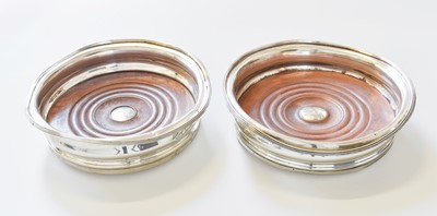 Lot 65 - A Pair of George IV Silver Wine-Coasters,...