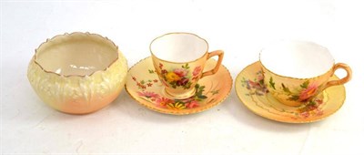 Lot 361 - A Royal Worcester tea cup and saucer; a Royal Worcester coffee cup and saucer; similarly decorated