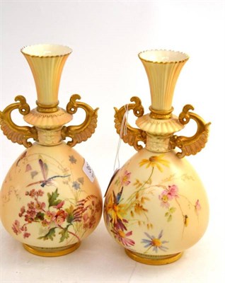 Lot 367 - A pair of Royal Worcester blush ivory vases, each with frilled, flared neck and scrolled,...