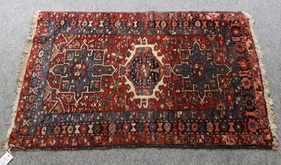 Lot 1256 - Karajah Rug, the deep madder field with three...