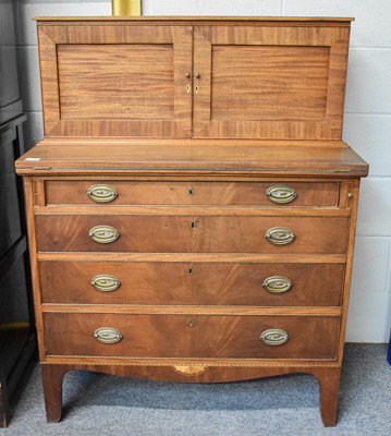 Lot 1302 - A Mahogany Writing Desk, the two door super...