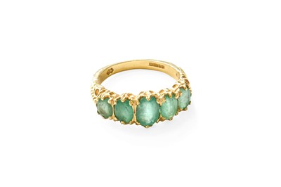 Lot 343 - An 18 Carat Gold Emerald Five Stone Ring, the...