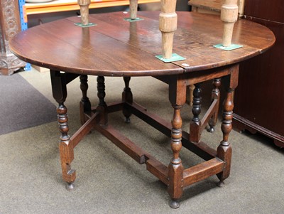 Lot 1124 - An 18th Century Oak Gateleg Table, the oval...