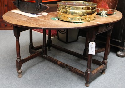 Lot 1232 - An 18th Century Oak Gateleg Table, the oval...