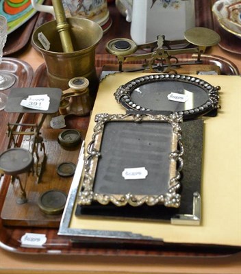 Lot 391 - Two pairs of brass and walnut postal scales and weights, a brass pestle and mortar, a pair of...