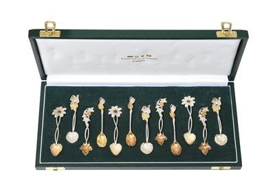 Lot 2107 - A Cased Set of Twelve Elizabeth II Parcel-Gilt and Patinated Silver Spoons