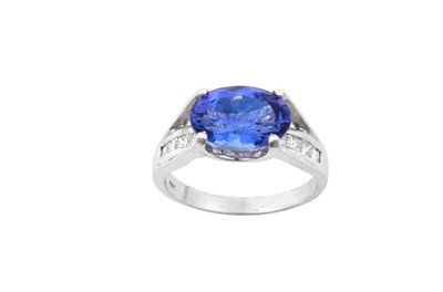 Lot 2247 - A Tanzanite and Diamond Ring the oval cut...