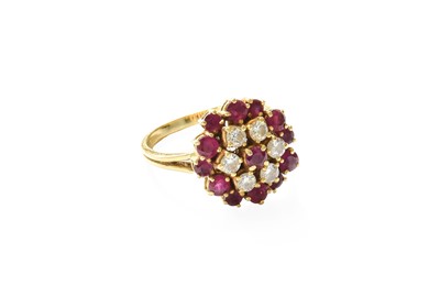 Lot 347 - An 18 Carat Gold Ruby and Diamond Cluster Ring,...