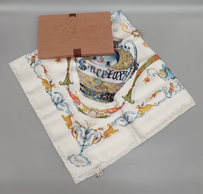 Lot 1172 - Gucci Silk Scarf, White Ground Printed with...