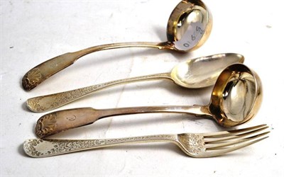 Lot 437 - A pair of William IV Scottish silver fiddle and shell pattern toddy ladles, Edinburgh 1833; a...