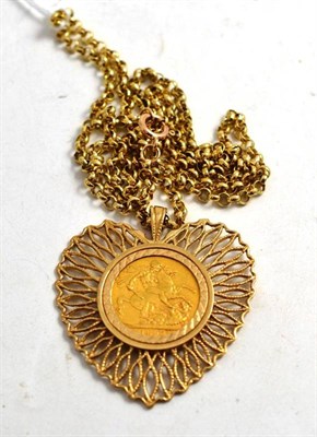 Lot 440 - A 1892 gold sovereign loosely mounted in a heart shaped pendant and chain