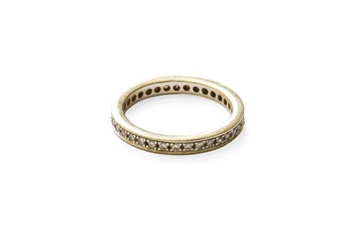 Lot 390 - A Diamond Eternity Ring, the round brilliant...