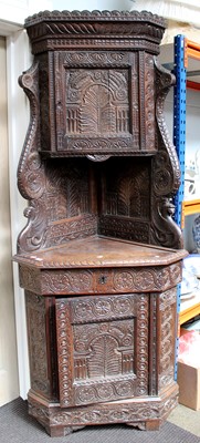 Lot 1122 - A 17th Century Style Heavily Carved Oak...