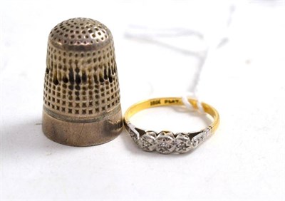 Lot 443 - A silver thimble by Charles Horner; and a diamond three stone ring stamped '18CT' and 'PLAT'