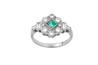 Lot 2063 - An Emerald and Diamond Cluster Ring the square...