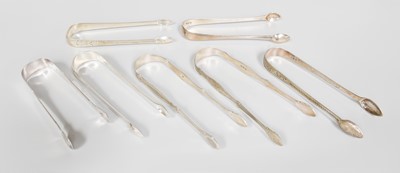 Lot 108 - Seven Pairs of George III Silver Sugar-Tongs,...