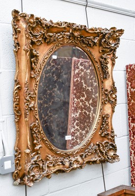 Lot 1362 - A Reproduction Gilt Framed Wall Mirror, with...