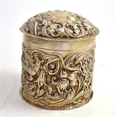 Lot 456 - A Victorian silver toilet jar and cover embossed with birds and foliage, London 1891