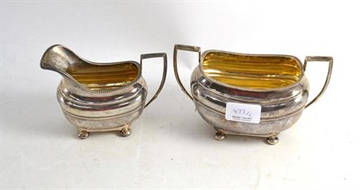 Lot 477 - A silver milk jug and sugar bowl, Birmingham and Chester 1926