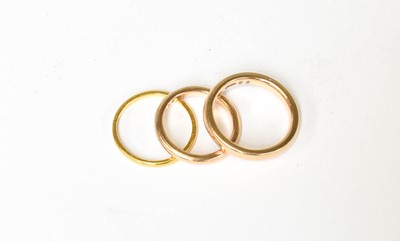 Lot 420 - A 22 Carat Gold Band Ring, finger size M; and...