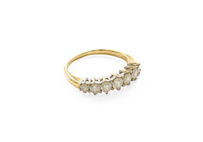 Lot 421 - An 18 Carat Gold Diamond Seven Stone Ring, the...