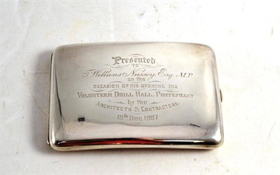 Lot 482 - A silver cigarette case, Birmingham 1907, with a presentation inscription to T Williams Hussey...