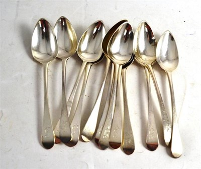 Lot 490 - A set of twelve George III silver Old English pattern dessert spoons, Newcastle hallmarks, by...