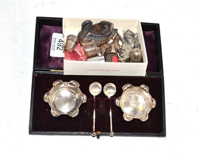 Lot 492 - Cased silver salts and spoons, silver pill box and cover, silver swan pin cushion and another...