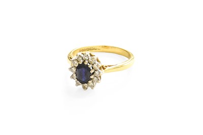 Lot 30 - An 18 Carat Gold Sapphire and Diamond Cluster...