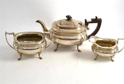 Lot 498 - A silver three piece tea set