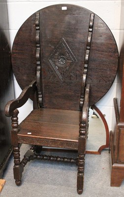 Lot 1345 - A 1920's Carved Oak Monks Chair, with tilt...