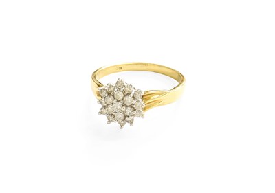 Lot 24 - A Diamond Cluster Ring, the central round...