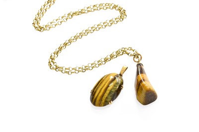 Lot 27 - A Tiger's-Eye Pendant on Chain, the irregular...